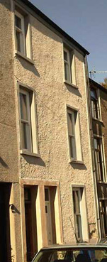 Town House in Ulverston, Cumbria, lime rendered, dashed and limewashed with silicate paint lime window reveals and concrete sills