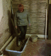 Helen treading a chimney parging mix