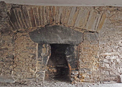 Infilled inglenook showing several fireplace phases