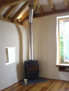 internal limework and oak floor and roof in a cob barn conversion
