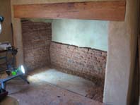 lime plastered and repointed fireplace