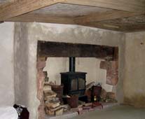 lime plastered walls and fireplance